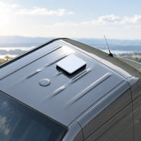 Starlink Mini protective case placed on a compatible metal vehicle roof with magnetic mounting bases.