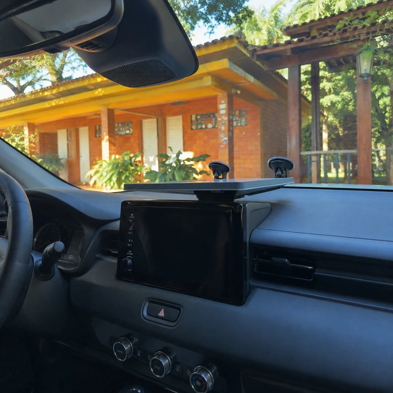 Low-profile Starlink Mini platform supported on a vehicle dashboard